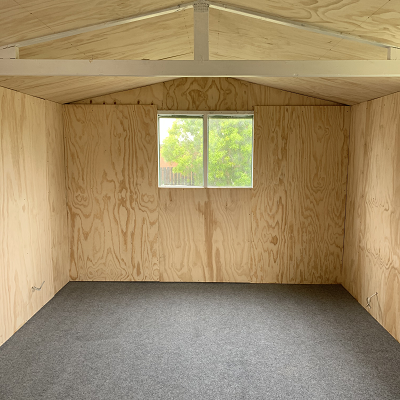 Light grey garage carpet with plywood walls  - Ace of Space NZ 